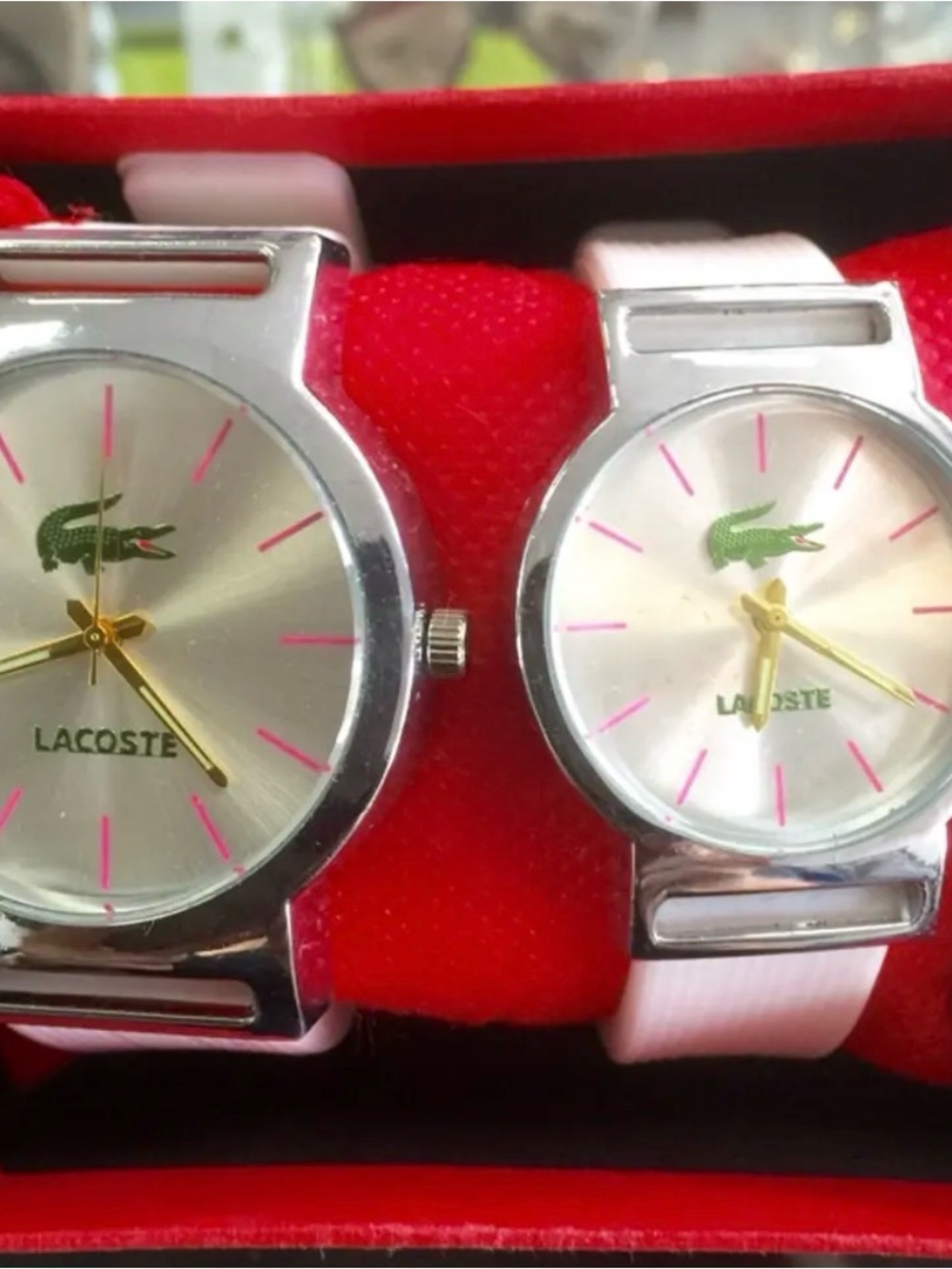 “Lacoste” His & Hers Silver Dial Watches with Pink Accents and Green Logo
